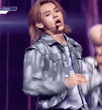 Young Man In Blue Jacket Singing Into Microphone GIF