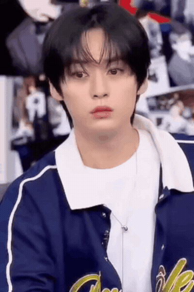 Young Man In Blue Jacket Sitting GIF