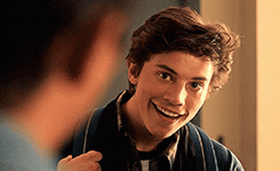 Young Man In Blue Jacket Smiling At Another Man GIF