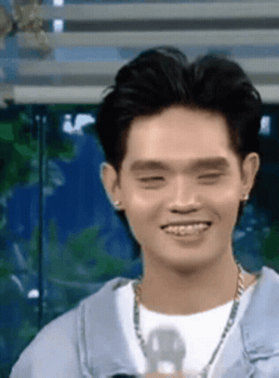 Young Man In Blue Jacket Smiling GIF