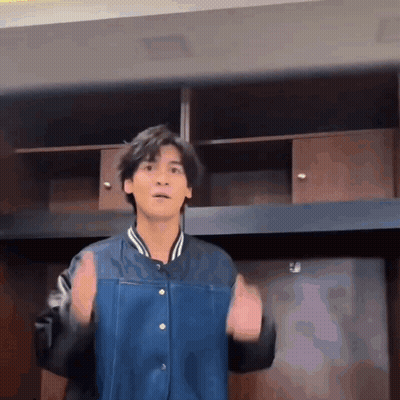 Young Man In Blue Jacket With Hands Up GIF