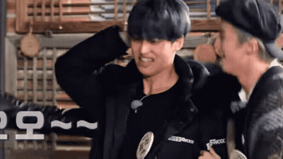 Young Man In Blue Shirt And Black Hat Making Funny Face GIF