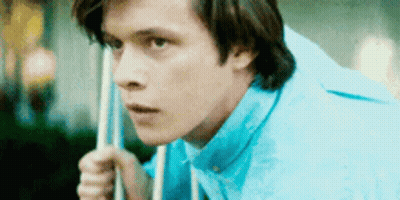 Young Man In Blue Shirt Holding Pool Cue GIF
