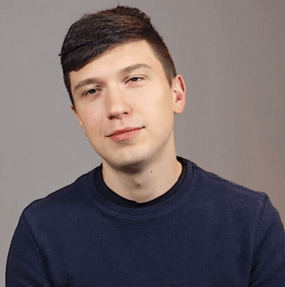 Young Man In Blue Shirt Shushing GIF