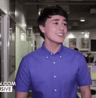 Young Man In Blue Shirt Smiling GIF