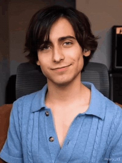 Young Man In Blue Shirt Smiling GIF