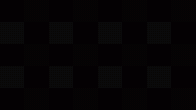 Young Man In Blue Shirt Smoking Against Wall GIF