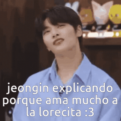 Young Man In Blue Shirt With Funny Face At Toys GIF