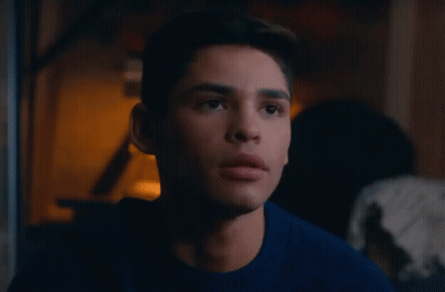 Young Man In Blue Sweater Looking At Camera GIF