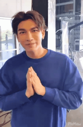 Young Man In Blue Sweater Making Funny Face GIF