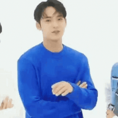 Young Man In Blue Sweater With Arms Crossed GIF