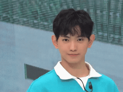 Young Man In Blue Sweater With Microphone GIF