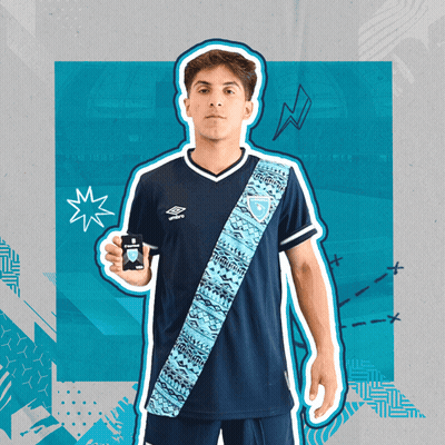 Young Man In Blue Umbro Shirt Holding Black Object GIF