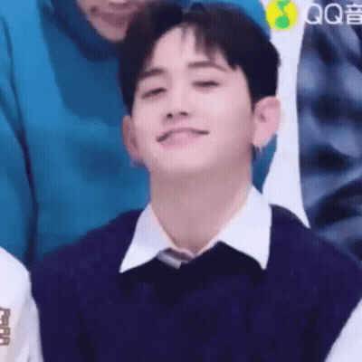Young Man In Blue Vest And White Shirt GIF