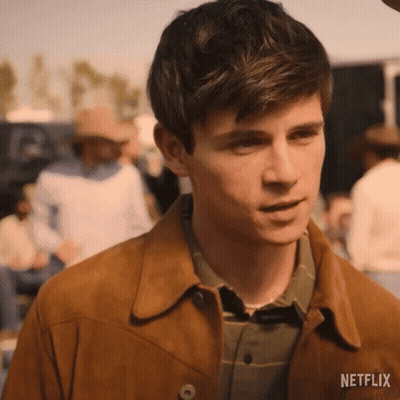Young Man In Brown Jacket And Plaid Shirt GIF