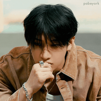 Young Man In Brown Jacket With Ring GIF