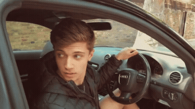 Young Man In Car With Audi Logo GIF