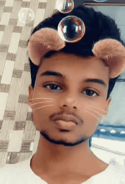 Young Man In Cat Mask With Bubbles Coming Out Of Ears GIF