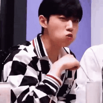 Young Man in Checkered Jacket Making Funny Face
