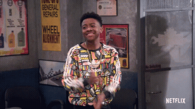 Young Man In Colorful Adidas Shirt At General Repairs Sign GIF
