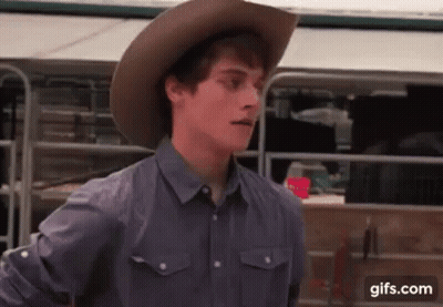 Young Man In Cowboy Hat And Gray Shirt GIF