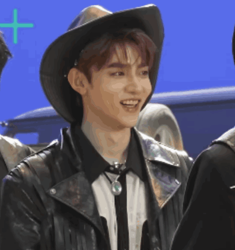 Young Man In Cowboy Hat And Leather Jacket Smiling GIF