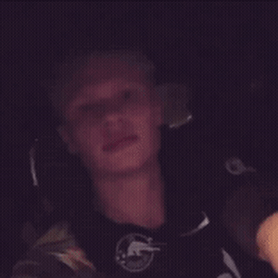 Young Man In Cowboys Shirt Sitting In Car GIF