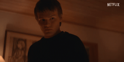 Young Man In Dark Room Netflix Logo GIF