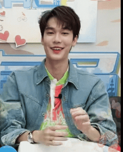 Young Man In Denim Jacket And Green Shirt GIF