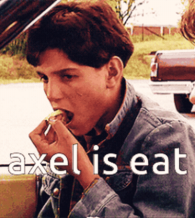 Young Man In Denim Jacket Eating GIF