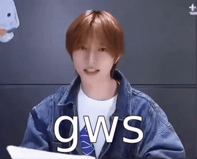 Young Man In Denim Jacket Holding Paper GIF