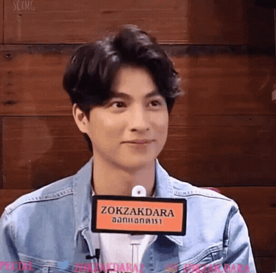 Young Man In Denim Jacket With Zokazdara Sign GIF