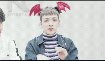 Young Man In Devil Wings Headband Making Heart With Hands GIF