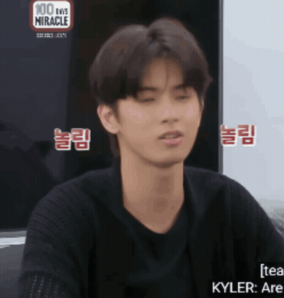 Young Man In Front Of 100 Days Miracle Screen GIF