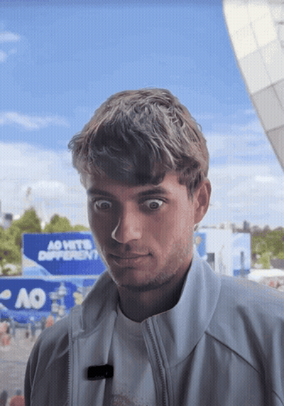 Young Man In Front Of Ao Sign GIF
