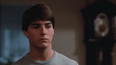 Young Man In Front Of Clock GIF