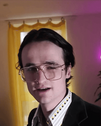 Young Man In Glasses And Black Jacket GIF