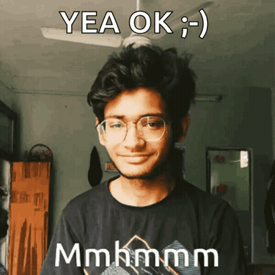 Young Man In Glasses And Black Shirt Saying Yea Ok GIF