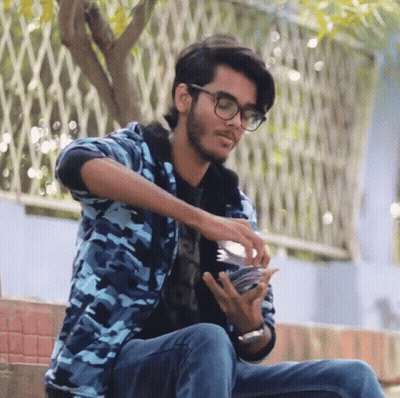 Young Man In Glasses And Blue Jacket GIF