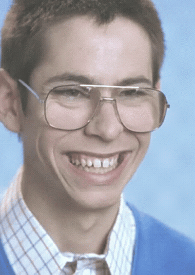 Young Man In Glasses And Blue Sweater Smiling GIF