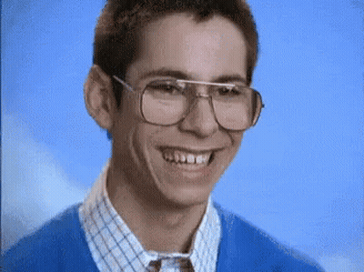 Young Man In Glasses And Blue Sweater Smiling GIF