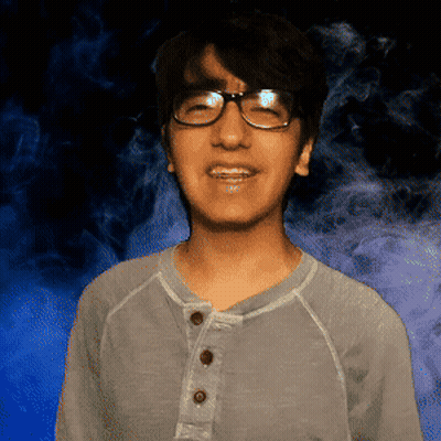 Young Man In Glasses And Grey Shirt Smiling GIF