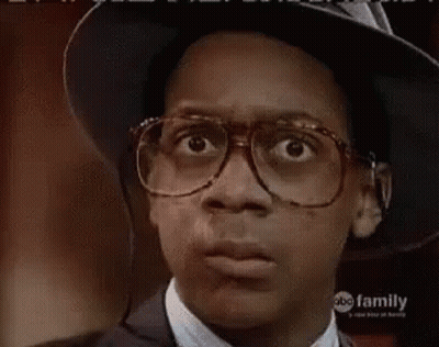 Young Man In Glasses And Hat Making Face GIF