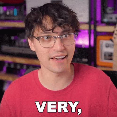 Young Man In Glasses And Red Shirt Saying Very GIF