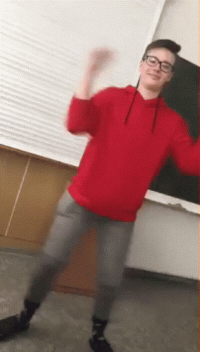 Young Man In Glasses And Red Sweatshirt Dancing GIF
