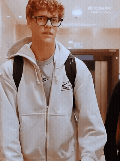 Young Man In Glasses And White Nike Sweatshirt GIF