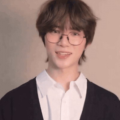 Young Man In Glasses And White Shirt Smiling GIF