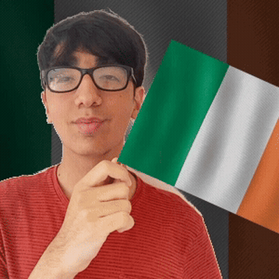 Young Man In Glasses Holding Green White And Orange Flag GIF