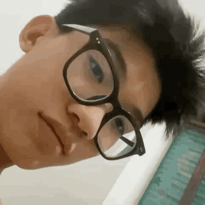Young Man In Glasses Making Funny Face GIF