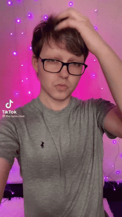 Young Man In Glasses Scratching Head GIF